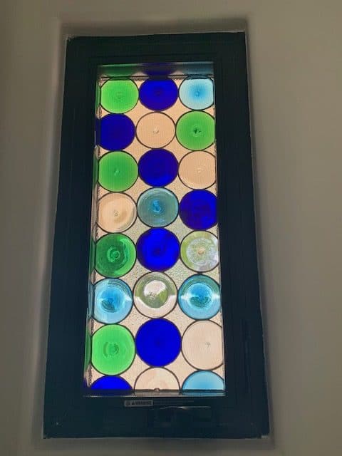 Rondel Stained Glass Window installed in a Bathroom