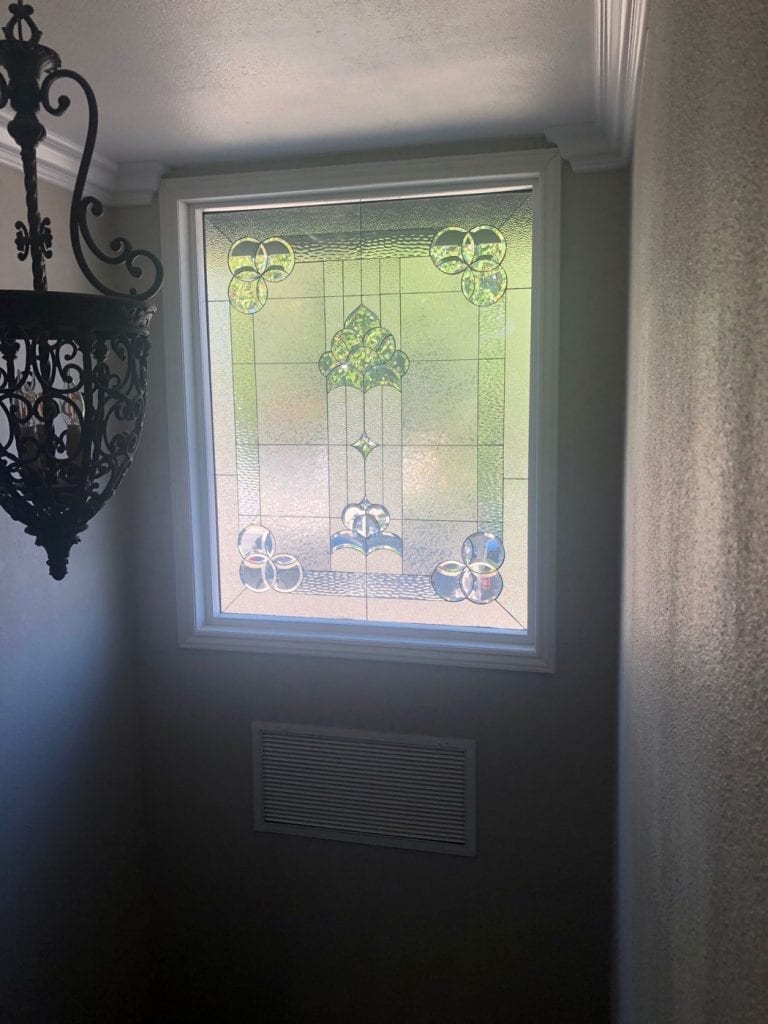 Clear and Beveled Stained Glass Stairway Window