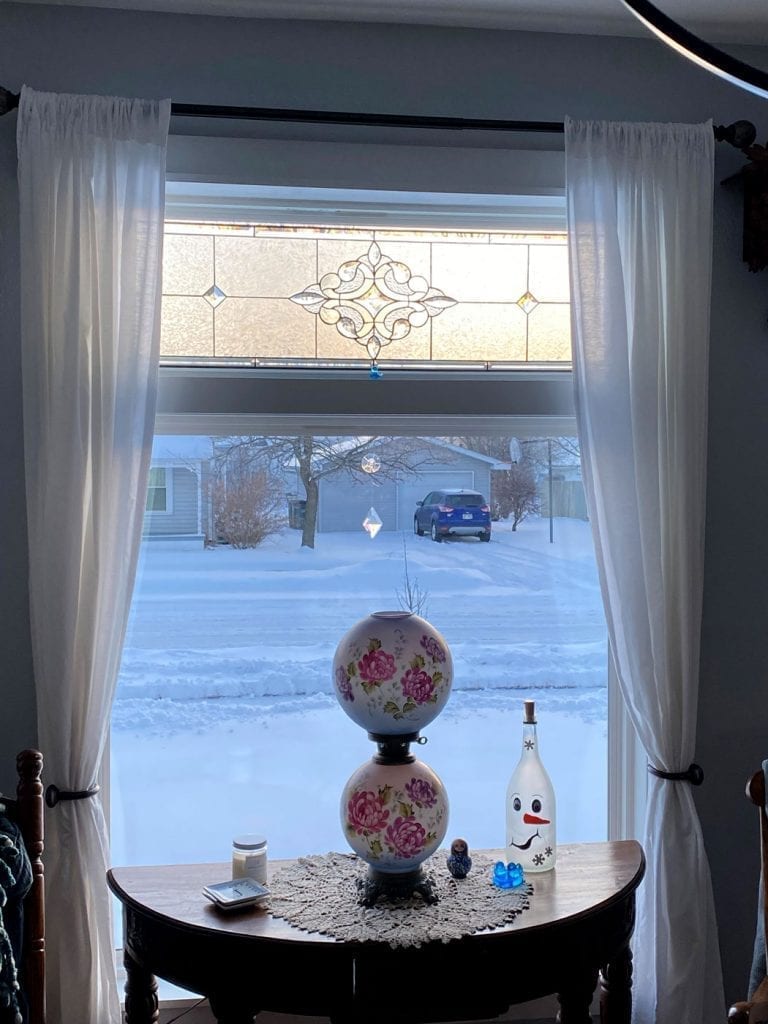 Amazing Stained Glass hung up over a Transom Window