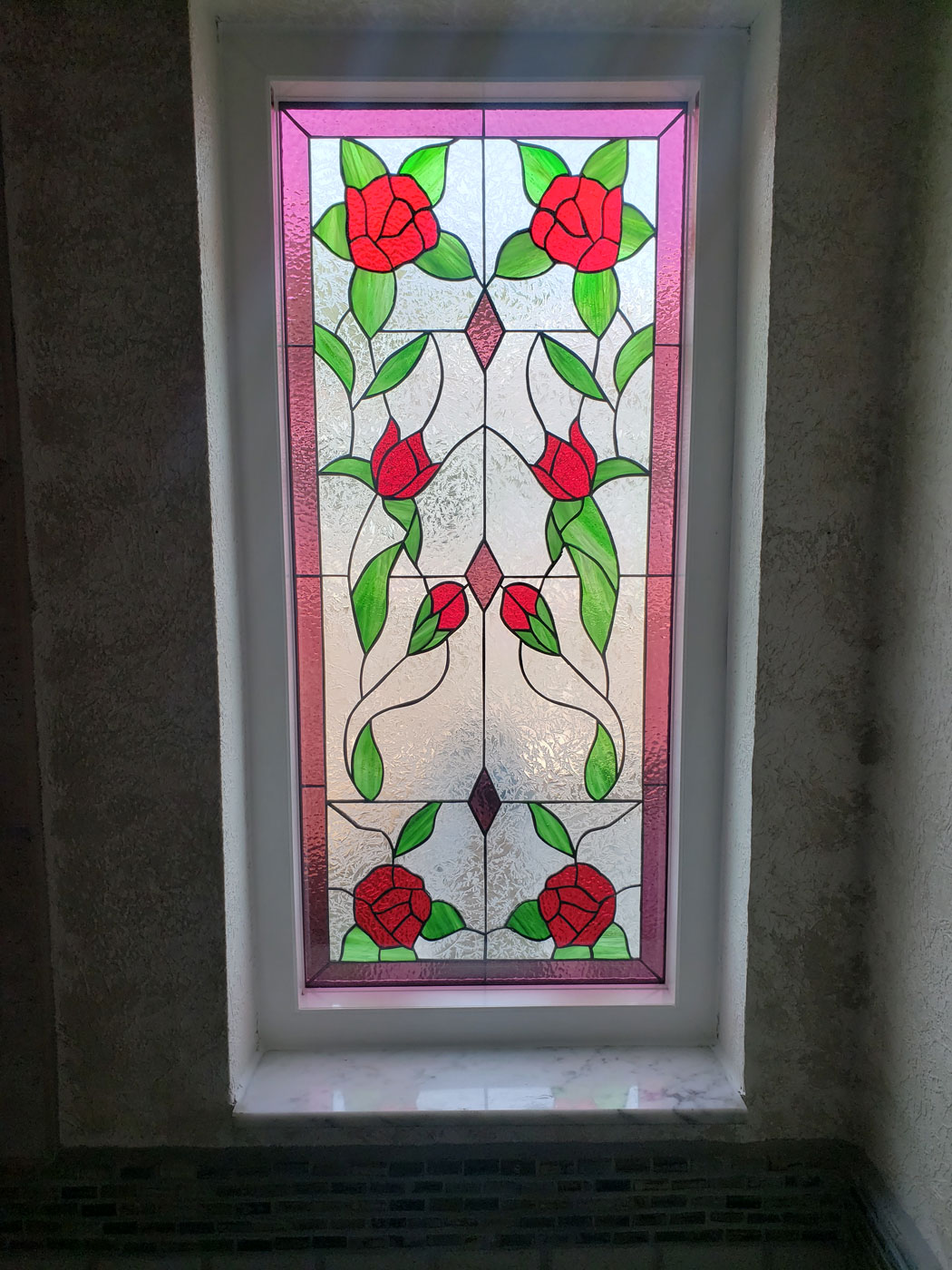 Installed, roses , stained glass in tempered glass and vinyl frame
