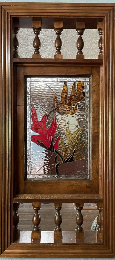 Single pane, installed between two rooms, fall leaves