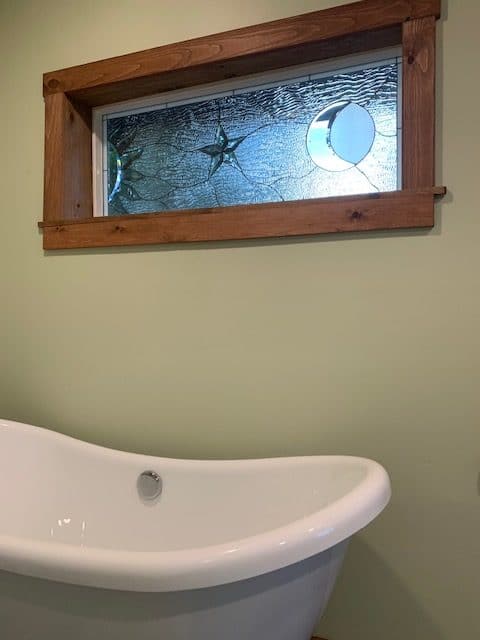 Clear Sun, Star and Moon Stained Glass installed over a Bathtub