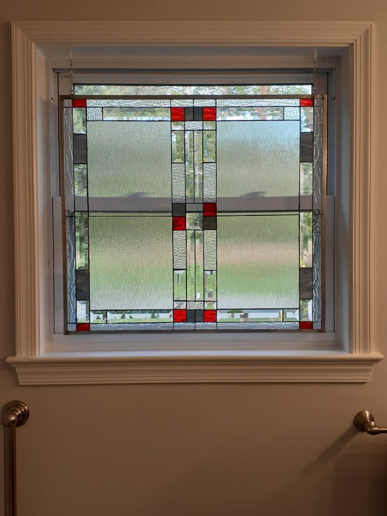 Mission Style Clear and beveled Stained Glass Window Installed ina Master Bathroom