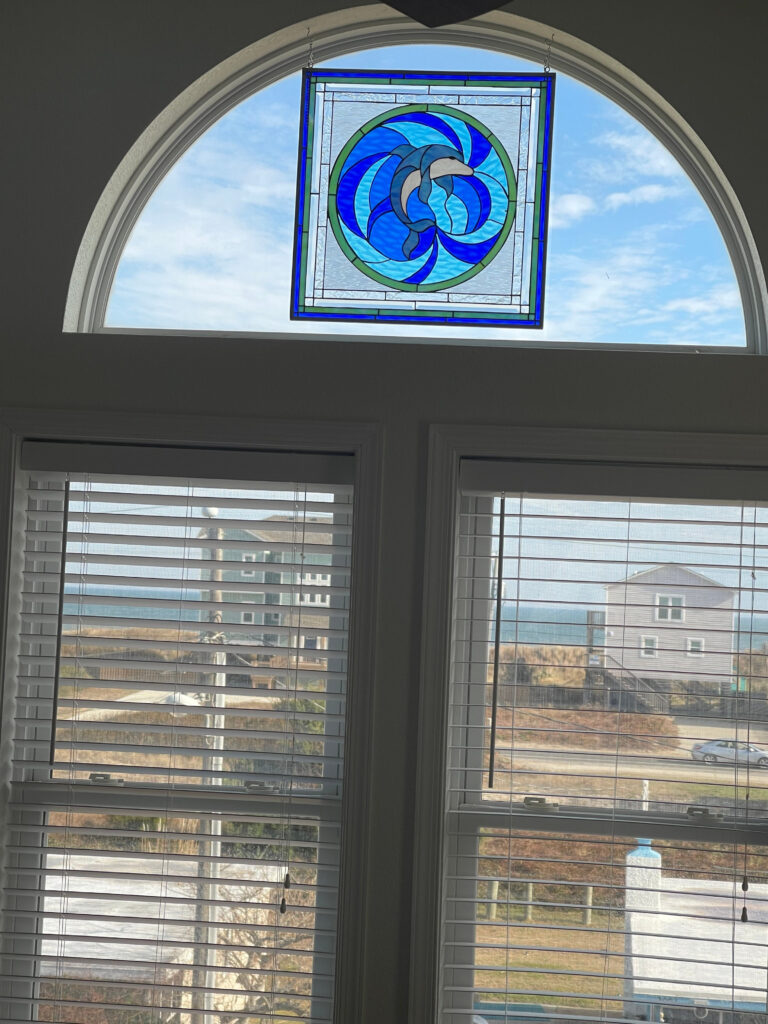 The “Blue Dolphin” Stained Glass hung with hooks and chains