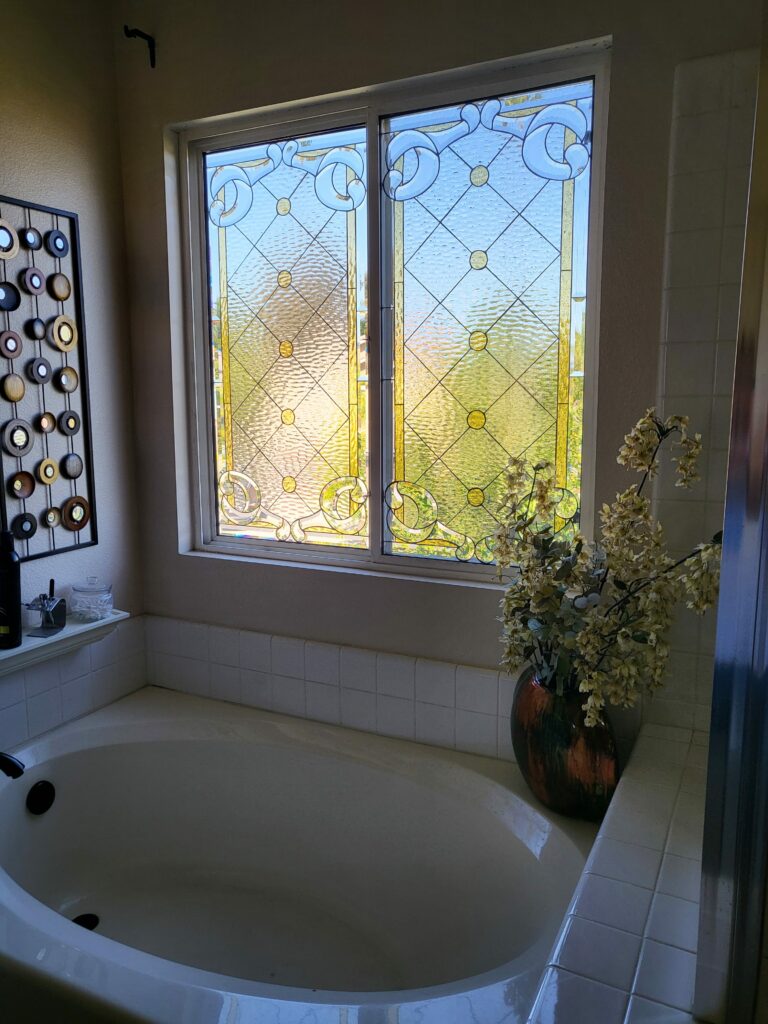 Stained Glass Window installed over a bathtub for Natural Light