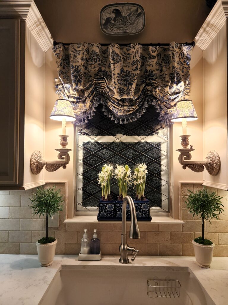 A rectangular leaded glass kitchen window panel featuring a diagonal grid of clear diamond-shaped panes overlaying a dark, intricately textured privacy glass background, installed above a kitchen sink.