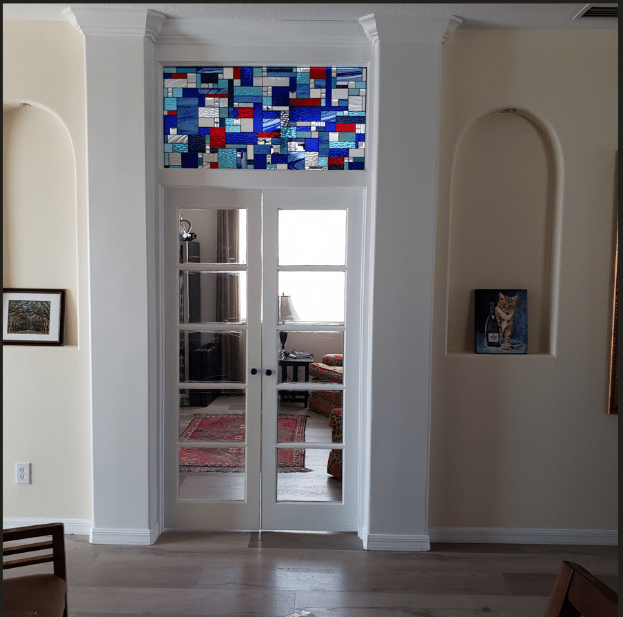 Single pane stained glass to mount between two rooms.