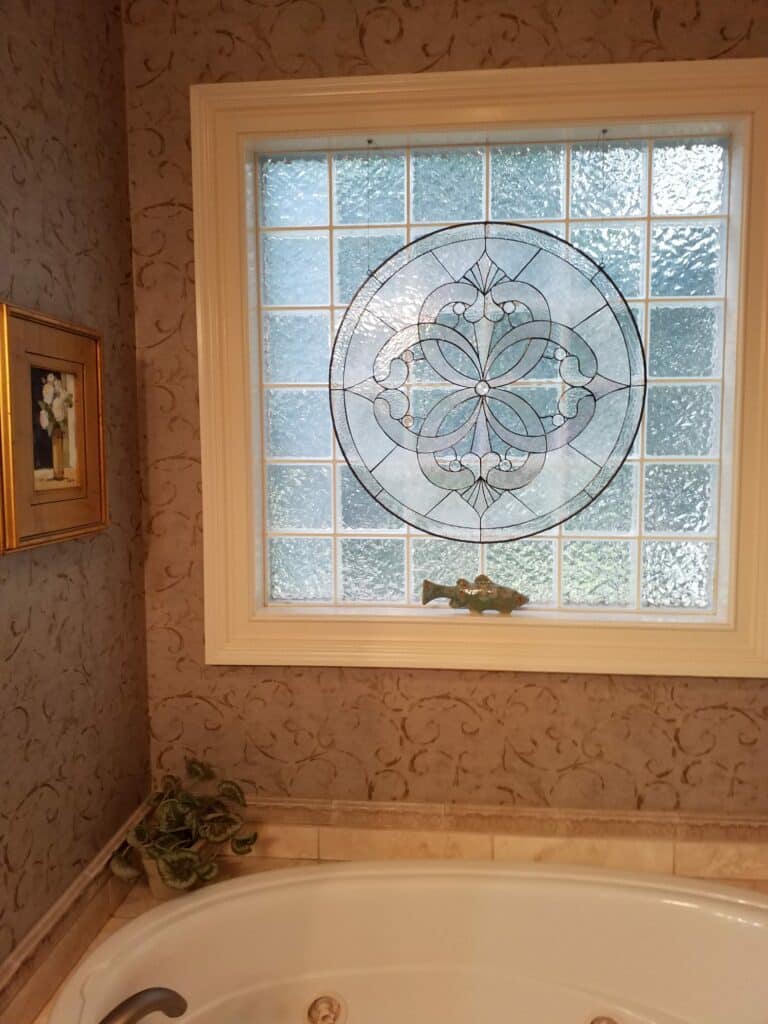 Elegant Beveled Stained Glass Installed over a Bathtub