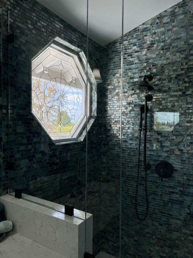 A Shimmering Clear Glass Window with a Shell Accent