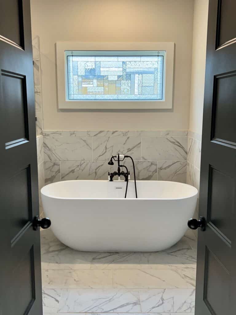 Before and After: Stained Glass, with loops for privacy installed over a Bathtub