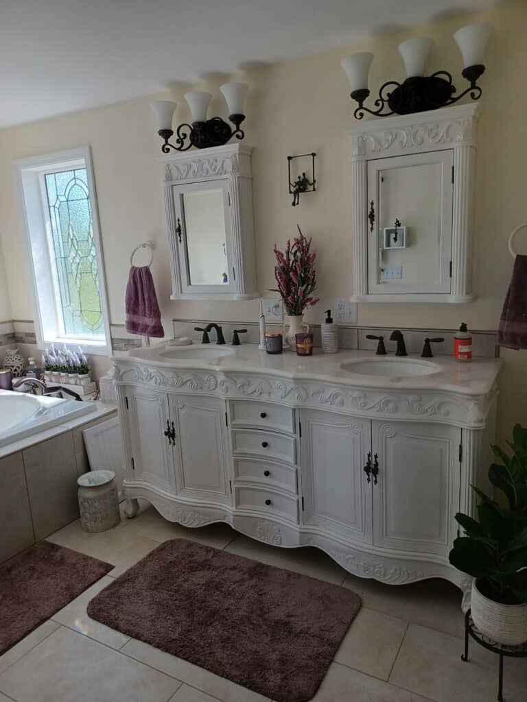 A tall, rectangular stained glass window featuring a geometric and organic pattern of clear textured and light green glass, set in a white frame.