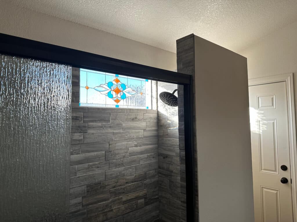 Clear and Beveled Stained Glass Installed in a Bathroom