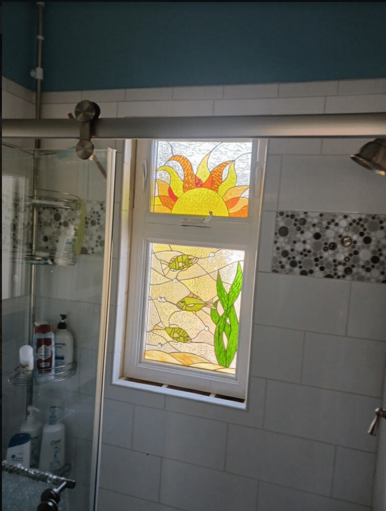 Sun and natural fish pond Stained Glass installed in a shower