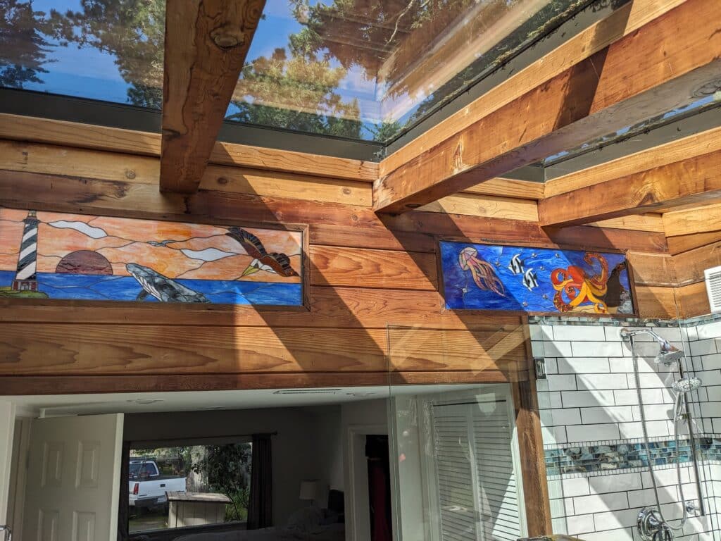 Stained Glass Ocean Scene Enhances Bathroom Retreat
