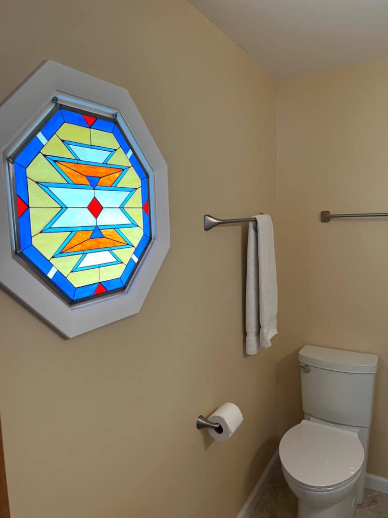 Octagonal Geometric Stained Glass Installed in a Bathroom