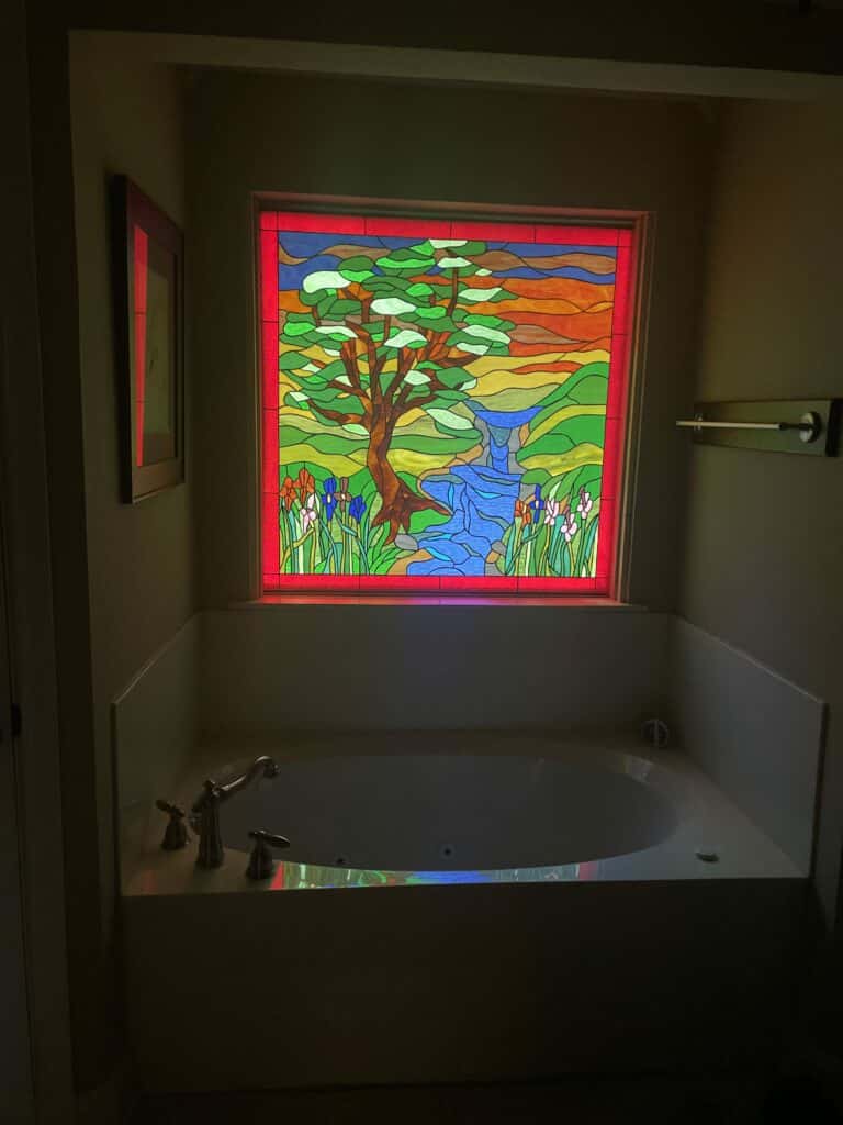 GLOWS! Stained Glass installed over a bathtub