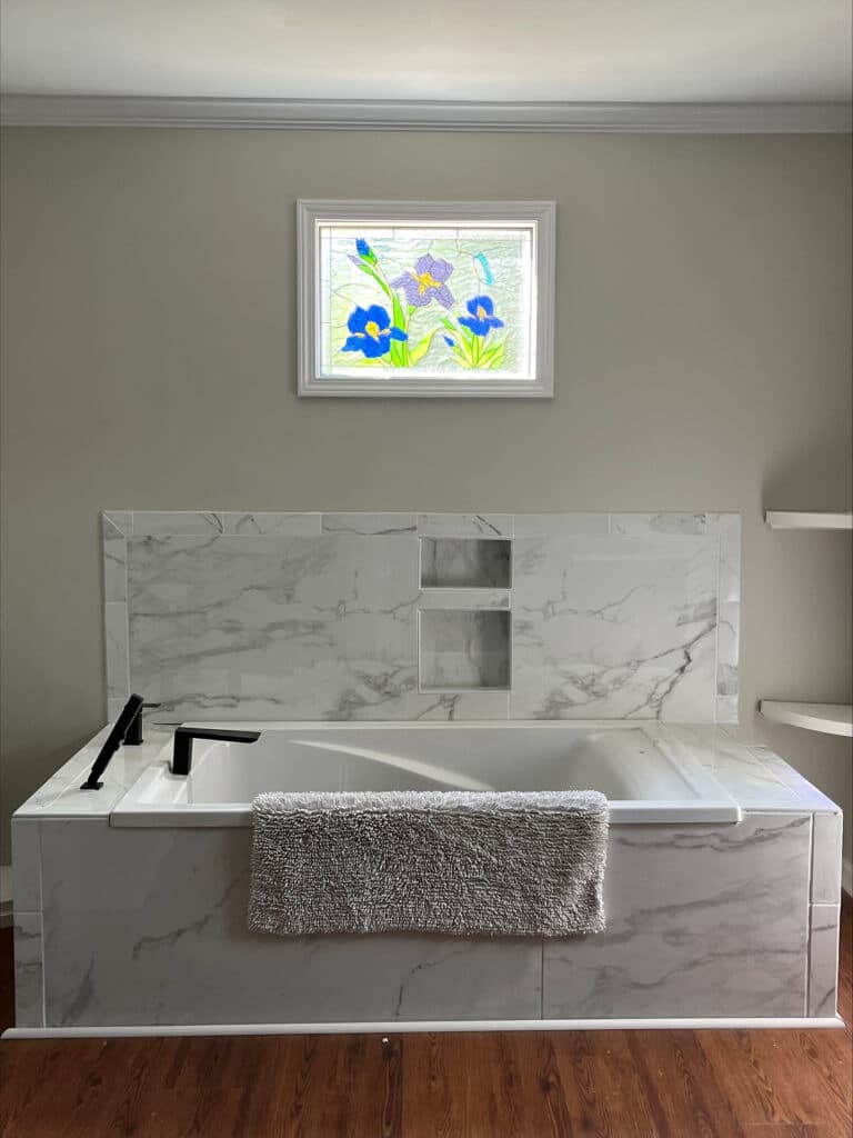 Elegant Iris and Butterfly Stained Glass Installed over a Bathtub