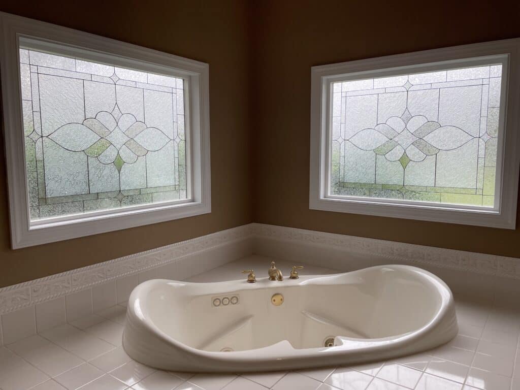 Elegant Stained Glass Windows Elevate Bathroom Ambiance