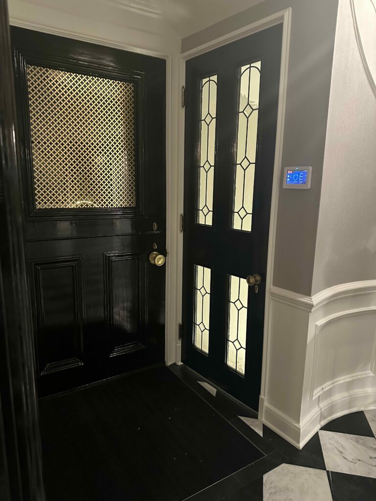 Elegant Clear and Beveled Glass Inserts Installed in Entry Door