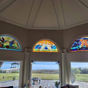 Arched Stained Glass Wildlife Transom Window Set A set of three arched stained glass transom windows. From left to right, the panels depict: two hummingbirds with flowers, two white cranes, and two owls on a branch at night.