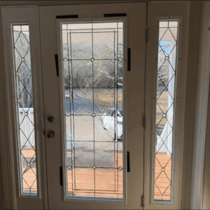 Rectangular Geometric Textured Clear Glass Entry Door and Sidelight Set A white double entry door with two rectangular sidelights, all featuring clear leaded glass. The main door panels have a wavy textured center framed by geometric rectangles and circles, while the sidelights display a diamond pattern with small circles.