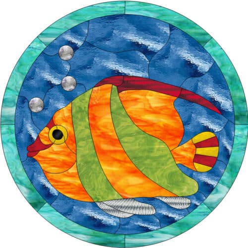 A round stained glass panel depicting a vibrant orange and green striped tropical fish with red fins and a yellow eye, swimming in textured blue water with three silver bubbles, all framed by a teal and turquoise border.
