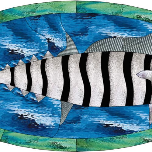 An oval leaded stained glass panel depicting a silver and black striped fish swimming in blue textured water, surrounded by a green border.